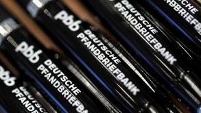 Pens printed with the writing 'Deutsche Pfandbriefbank' are seen during the financial statements press conference of Hypo Real Estate (HRE) in Munich, Germany, 01 March 2012. The commercial property lender presented its balance sheets of 2011. Photo: FRAN