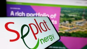 Cellphone with logo of Nigerian oil company Seplat Energy plc in front of business website. Focus on center of phone display.