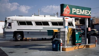 Overland coach waiting at a Pemex filling station in Texcoco, a suburb of  Mexico City.