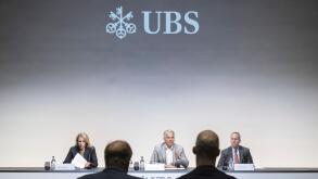 Group Chief Executive Officer of Swiss Bank UBS Sergio P. Ermotti, center, speaks next to Marsha Askins, left, and Todd Tuckner, right, during the presentation of the second quarter 2023 and first results since the Credit Suisse merger, in Zurich, Switzer