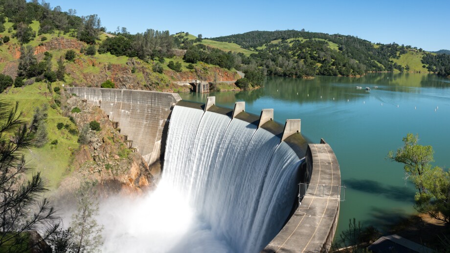 Water spills over the top of Englebright Dam on the Yuba River.