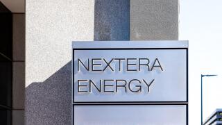 Houston, Texas, USA - February 27, 2022: NextEra Energy sign is seen at its office building in Houston, Texas, USA.
