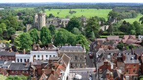 View of part of Warwick town centre, with Church Street in the foreground and Warwick Castle beyond.