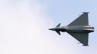 An RAF Eurofighter Typhoon FGR4 aircraft in flight, view from above, Duxford airport, Cambridge UK