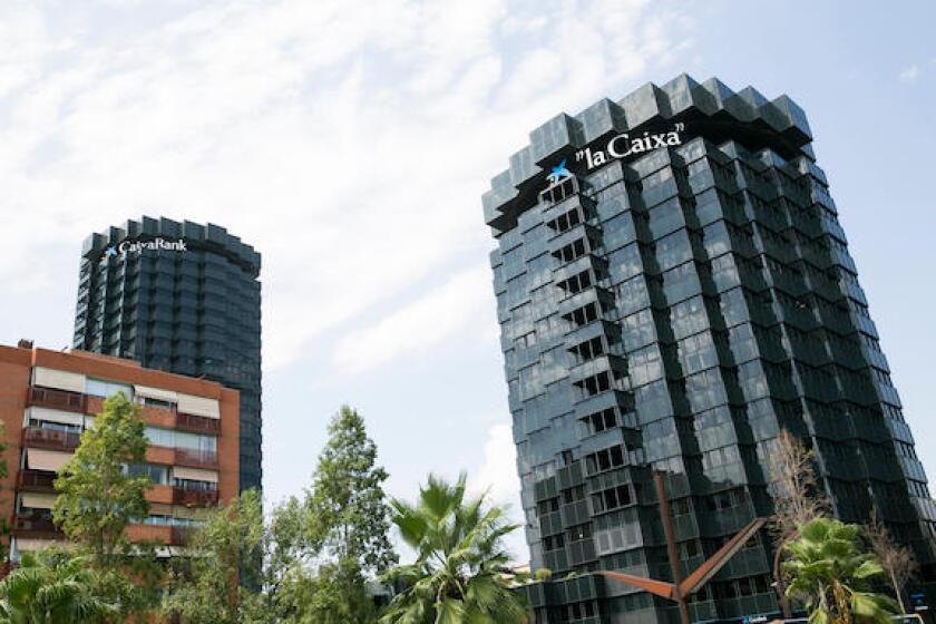 A logo sign outside of the headquarters of the La Caixa group and Caixa Bank in Barcelona, Spain on August 24, 2017.