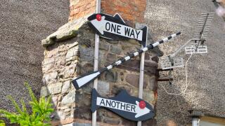 Sign on cottage in Porlock Weir, Somerset, one way oar another.