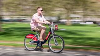 Cyclist using Santander Cycle Hire Scheme, London, UK