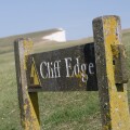 Cliff Edge sign on Beachy head coastline East Sussex England UK