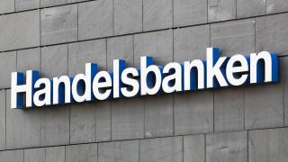 Aarhus, Denmark - August 7, 2020: Handelsbanken logo on a wall. Handelsbanken is a Swedish bank providing universal banking services