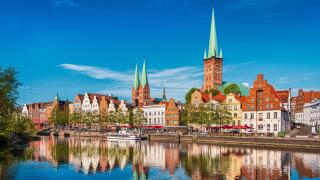 Historic skyline along the Trave river in the old town of Lubeck, Germany on a summer day
