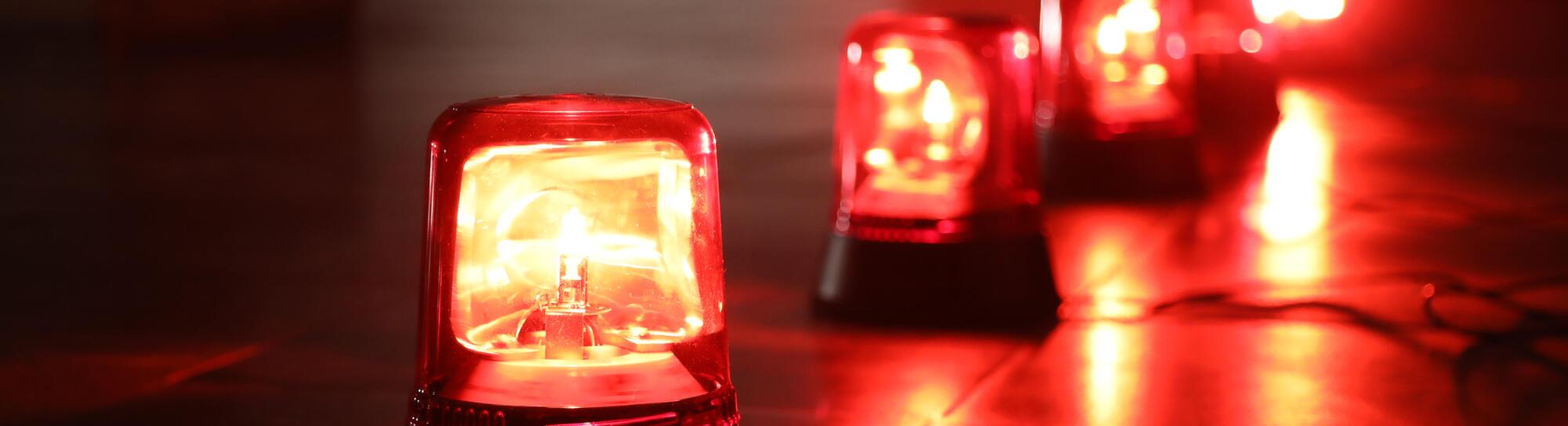 Background with big red flashing alarm lights.