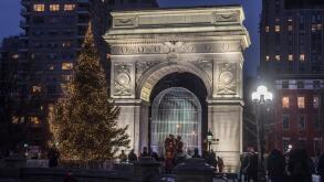 New York, NY, USA 16 December 2016 - The Annual Christmas Tree in Fountain Plaza while the Weiwei sculpture, Good Fences Make Good Neighbors, occupies the tree's traditional location under the Washington Arch, in Washington Square Park. CREDIT ©Stacy Wals