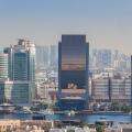 UAE, Dubai, Deira. Hilton Hotel, Emirates NBD bank and Dubai Chamber of Commerce buildings, elevated view