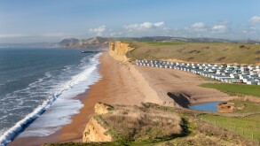 Static caravans with beach views on a coastal holiday park near Burton Bradstock, Dorset, England. Winter (February) 2011.