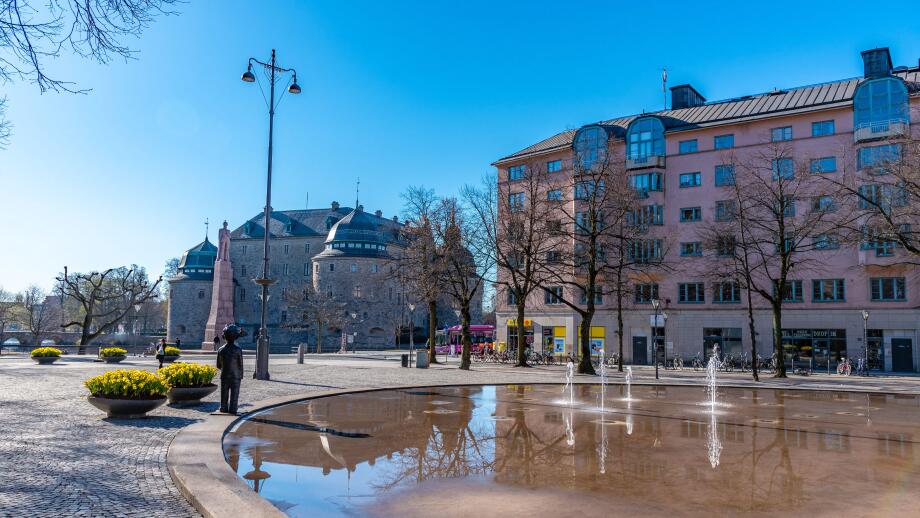 OREBRO, SWEDEN, APRIL 19, 2019: Monument of Carl XIV Johan and Orebro Slott castle in Orebro, Sweden