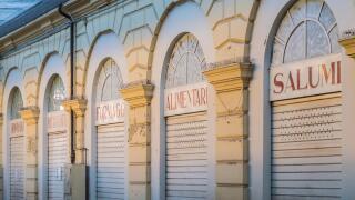Traditional italian food stores: cheese, cured meat etc... crisis, shops with lowered shutters