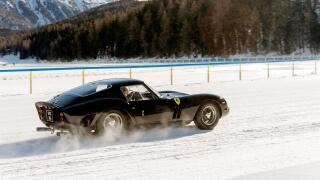 Classic vintage antique sports cars racing on the frozen lake of St Moritz