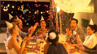 Friends throwing confetti at birthday party
