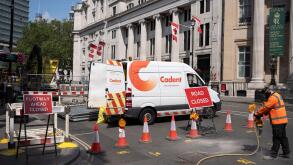 A worker with gas network supplier Cadent, starts drilling into the road surface while Cockspur Road is closed to traffic, causing wide disruption to the Trafalgar Square area, on 19th June 2023, in London, England.