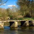 St.John's Bridge, a clapper bridge in Eastleach in Gloucestershire, Cotswolds, England, UK over the River Leach.. Image shot 03/2006. Exact date unknown.