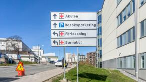 Stockholm, Sweden - April 15, 2021: Traffic signs with directions explained at the entrance to hospital area