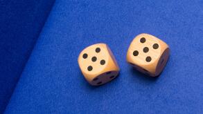 Two gambling dice showing two fives