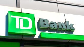 TD Bank sign, logo on bank branch. TD Bank, N.A., is an American national bank and subsidiary of the Canadian multinational Toronto-Dominion Bank - Ne