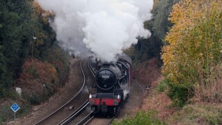 Steam Train under full power, approaching Bournemouth on the Weymouth to Waterloo Line, Dorset, England, UK.. Image shot 2010. Exact date unknown.