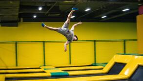 trampoline jumper performs acrobatic exercises on the trampoline