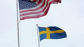 The Swedish flag and the US flag in Stockholm, Sweden, during Sunday afternoon.