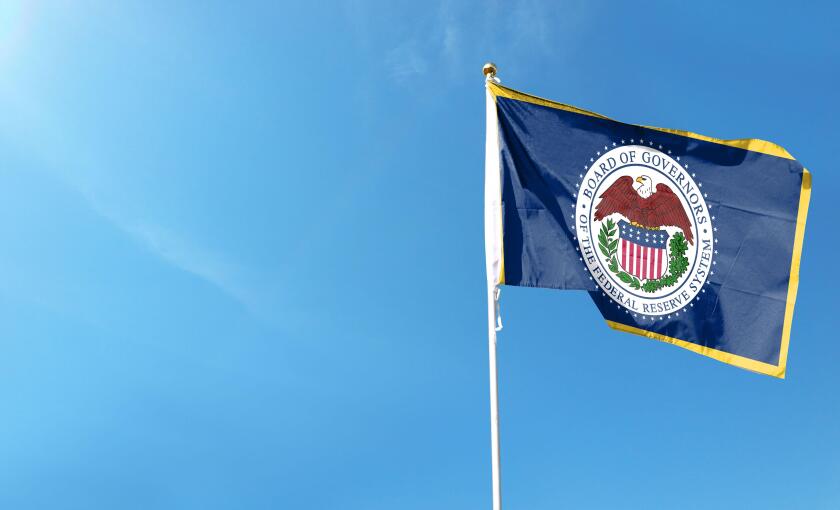 U.S. Federal Reserve flag on cloudy sky. waving in the sky