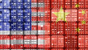 Flags of the USA and China on stacked containers, tariff war