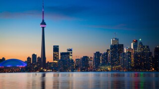 Downtown Toronto skyline, including CN Tower and Rogers Center, as seen in the early evening