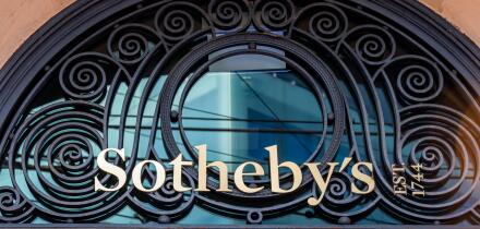 Sign and logo at the entrance to the Sotheby's building in Geneva. Sotheby's is a multinational company specializing in fine art and luxury objects