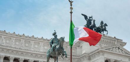 Italy flag city landmark, view of the national flag of Italy sited at the Vittorio Emanuele Monument in the historic centre of Rome, Italy