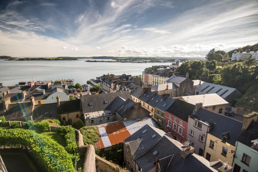 Terraced streets of colourful houses in the small tourist city of Cobh on the shores of Cork Harbour on the south coast of Ireland.