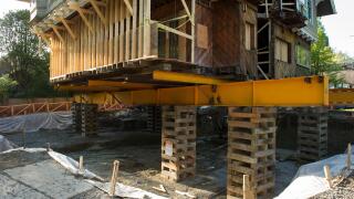 Older home in the neighborhood of Shaughnessy being raised for renovations, Vancouver City.