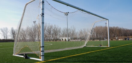 Wheeled mobile goalposts and net on a soccer pitch in Toronto Ontario Canada