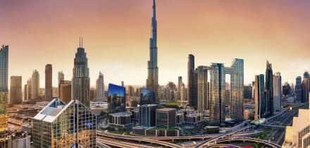 Dubai skyline at sunset with Burj Khalifa - aerial view, United Arab Emirates