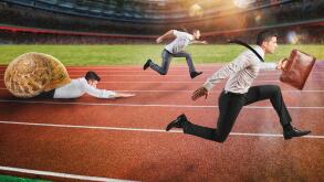 Businessman wins against a competitor slow like a snail