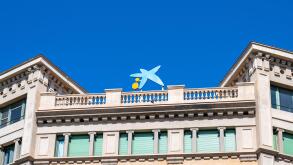 Logo or sign of Caixa Bank on top of an old building