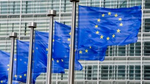 EU flags in front of European Commission in Brussels