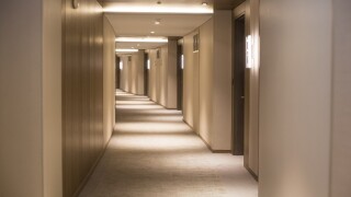 Empty hotel corridor from Adobe 9Jul20 575x375