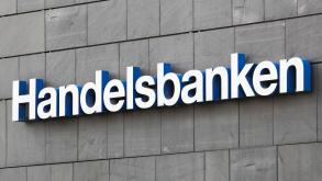 Aarhus, Denmark - August 7, 2020: Handelsbanken logo on a wall. Handelsbanken is a Swedish bank providing universal banking services