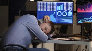 Tired stock exchange trader sleeping in office