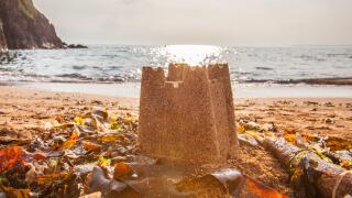Sand castle on Hope Cove beach, Devon, England, United Kingdom.