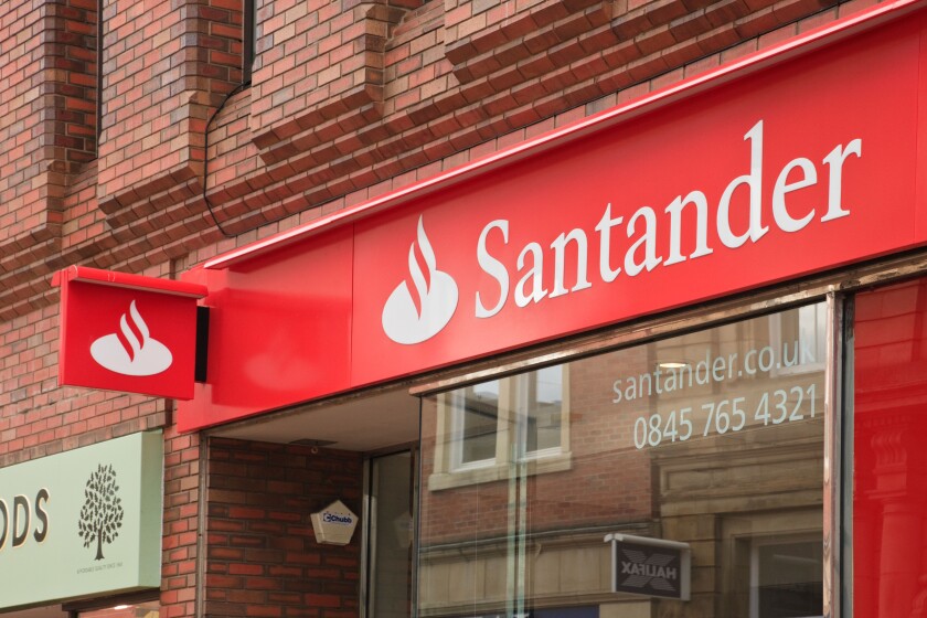 Santander bank logo and sign above the local branch front window in Wrexham, North Wales, UK, Britain
