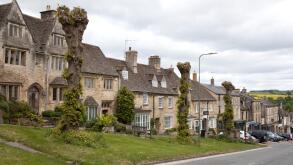 Houses on the High Street in Burford, Oxfordshire in the UK