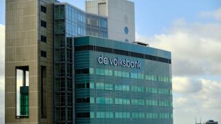 Utrecht, The Netherlands - March 17 2022:  Top floors of de Volksbank building with blue sky and light cloud.