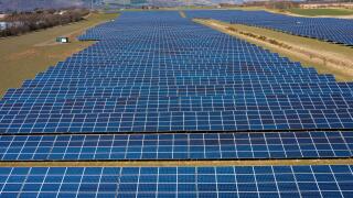 Aerial view from drone of solar panels in  solar energy farm in Scotland, UK